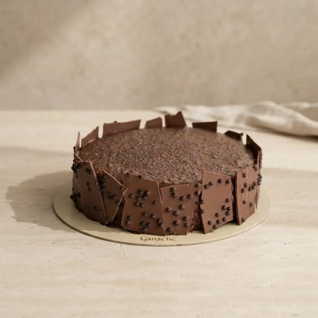 A Ganache chocolate cake with chocolate shards