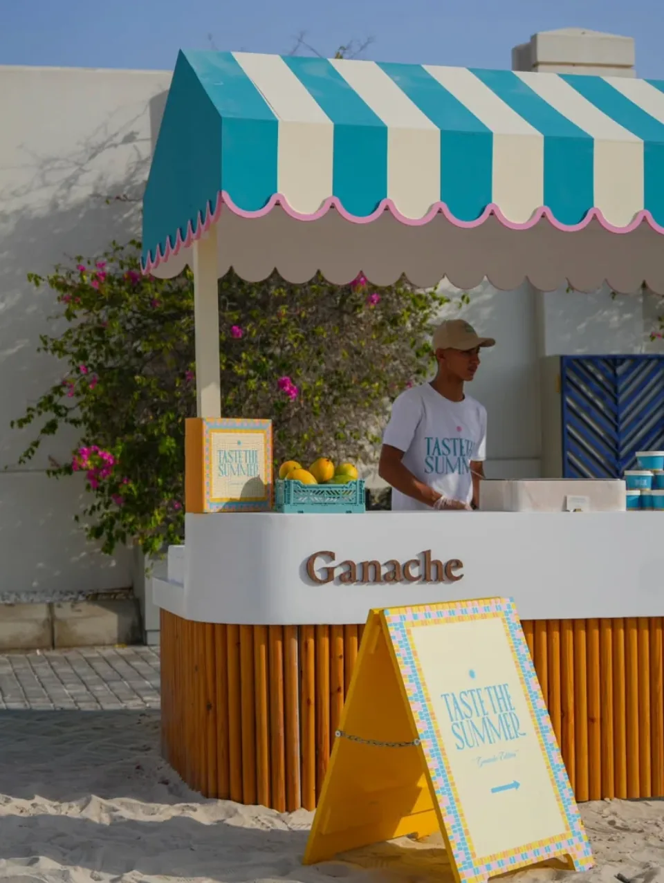 Ganache serving desserts at an outdoor gathering